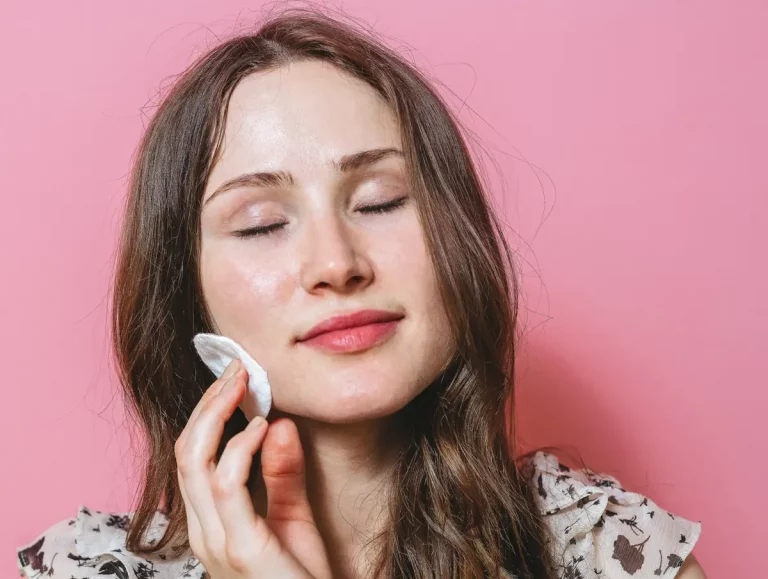 woman removing makeup naturally